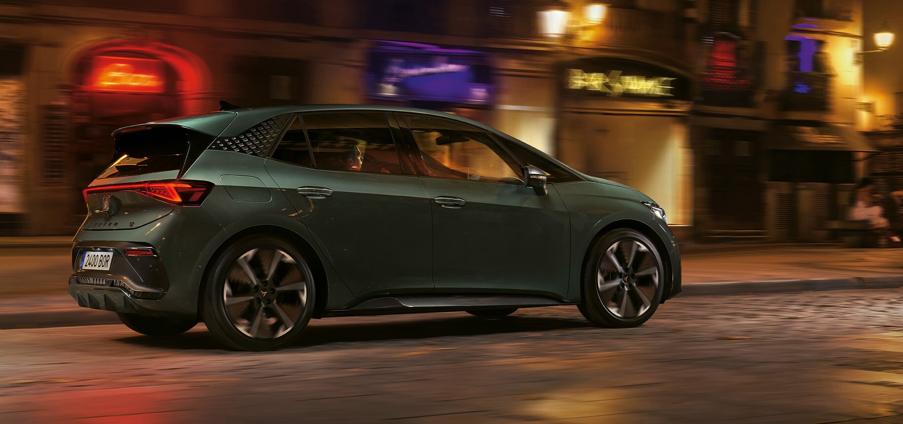 cupra formentor and man wating to received roadside assistance for electric and hybrid cars