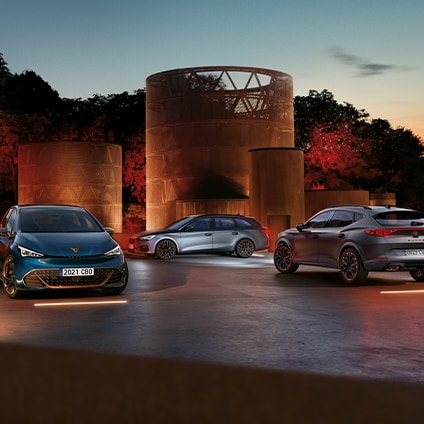 three cupra vehicles and cupra copper sculptures in background