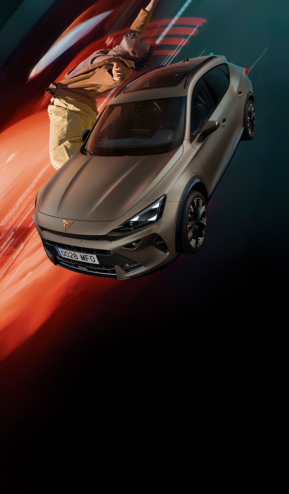 A CUPRA Leon Sportstourer shown from an elevated angle, with a person draped in dark, flowing fabric that creates a dynamic, red-lit trail beside the car.